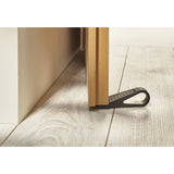 Cuña Tope de Bloqueo para Puertas y Ventanas M035Q Mottez - Negro, calzada bajo una puerta de madera con el lazo hacia afuera